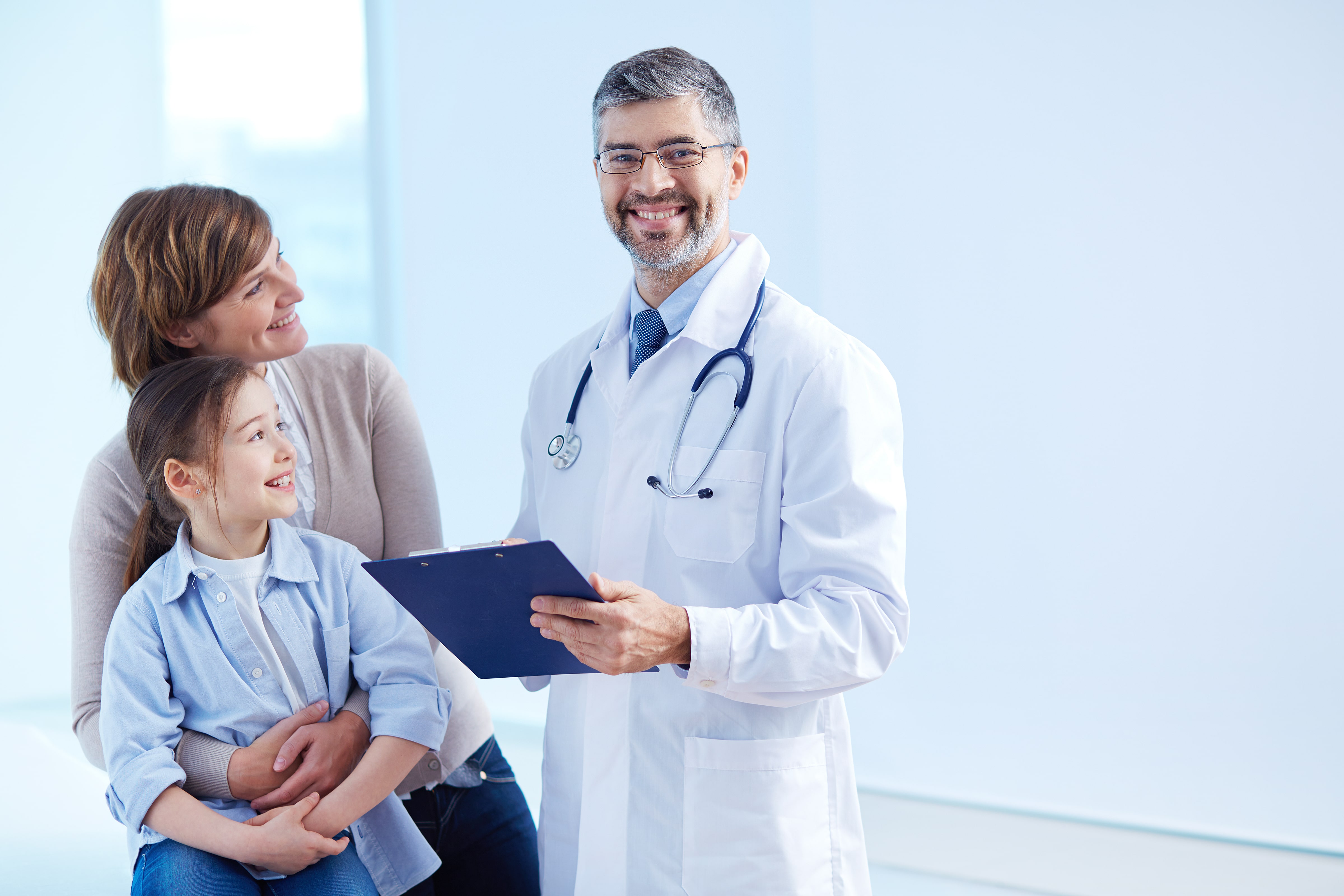 happy-doctor-holding-clipboard-with-patients (1)-min