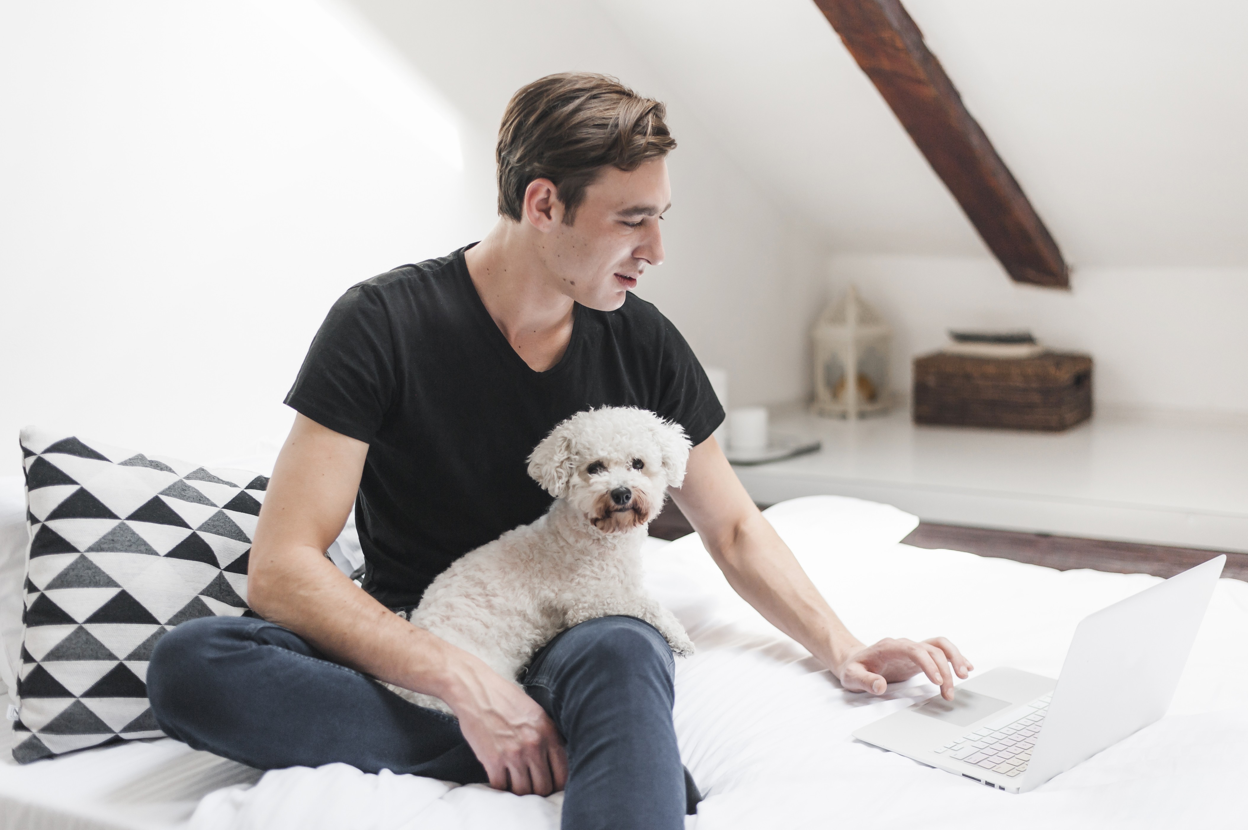 portrait-owner-with-his-friendly-dog-using-laptop-home